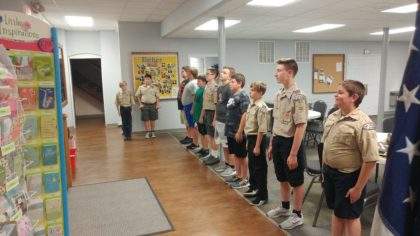 Lining up for flag retirement after the meeting - Troop 1086